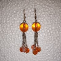Pendientes colgantes naranjas elegantes image
