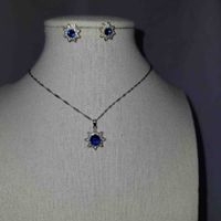 Juego de collar y aretes flor azul plata 925 image