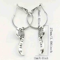 Aretes colgantes de espiral costura image