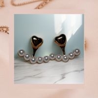 Aretes corazón y perla image