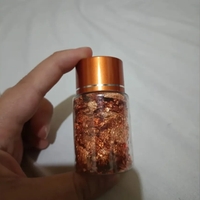 Papel de oro en frasco para las uñas o para manualidades image